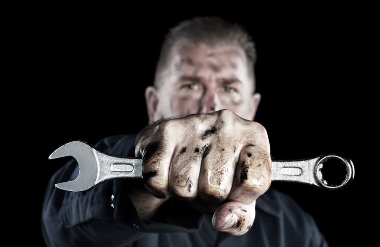 Technician showing a tool to the camera