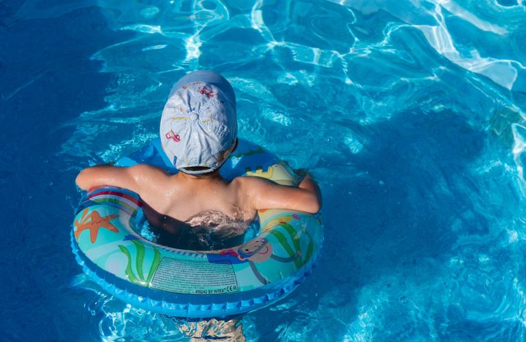 kid swimming in pool