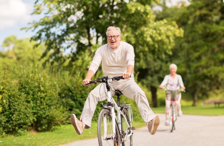 Two old people enjoying at a park