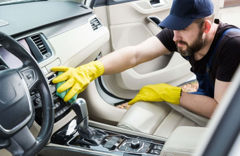 A man cleaning car