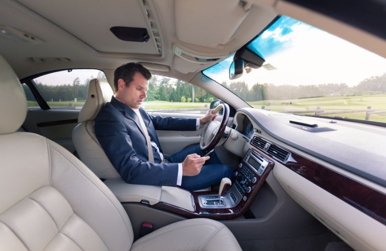 a man texting while driving