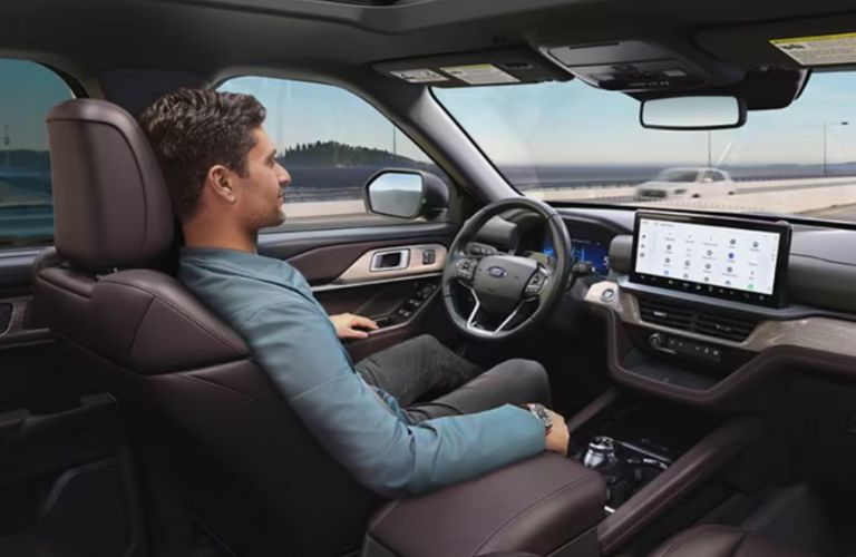 a man using hands-free driving in a Ford