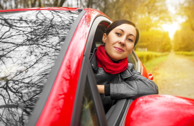 a woman with her head out the window