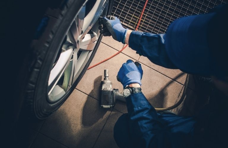 technician repairing a tire